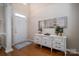 Inviting foyer with hardwood floors, stylish console table, and decorative mirrors at 133 Castaway Trl, Mooresville, NC 28117