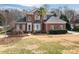 Charming two-story brick home with landscaped front yard and mature tree at 133 Castaway Trl, Mooresville, NC 28117