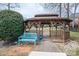 Charming gazebo with a blue bench, offering a serene spot to relax and enjoy the community's outdoor spaces at 133 Castaway Trl, Mooresville, NC 28117