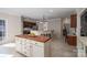 Bright kitchen features a center island, stainless appliances, and a breakfast bar area at 133 Castaway Trl, Mooresville, NC 28117