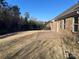 Brick patio and fenced backyard with a view of the woods at 1336 Stonecrest Blvd, Fort Mill, SC 29708