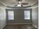 Bright bedroom with ceiling fan and two windows at 1336 Stonecrest Blvd, Fort Mill, SC 29708