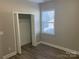 Bright bedroom with wood-look floors and a spacious closet at 1336 Stonecrest Blvd, Fort Mill, SC 29708