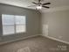 Spacious bedroom with carpeted floors and ceiling fan at 1336 Stonecrest Blvd, Fort Mill, SC 29708