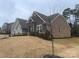 Brick house with stone accents, situated on a grassy lot with mature trees at 1336 Stonecrest Blvd, Fort Mill, SC 29708