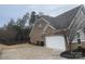 Attached two-car garage with a large driveway and a fenced backyard at 1336 Stonecrest Blvd, Fort Mill, SC 29708