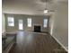 Bright living room features hardwood floors and a fireplace at 1336 Stonecrest Blvd, Fort Mill, SC 29708