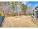 Large backyard with a fenced area and mature trees at 1380 Secret Path Dr, Fort Mill, SC 29708