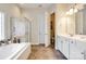 Spa-like bathroom featuring a soaking tub, shower, and double vanity at 1380 Secret Path Dr, Fort Mill, SC 29708