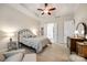 Spacious bedroom with carpeted floors and access to the bathroom at 1380 Secret Path Dr, Fort Mill, SC 29708