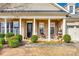 Inviting front porch with brick columns and seating area at 1380 Secret Path Dr, Fort Mill, SC 29708