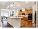 Kitchen boasts granite countertops, ample cabinetry, and stainless steel appliances at 1380 Secret Path Dr, Fort Mill, SC 29708