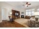 Spacious living room features hardwood floors, a fireplace, and built-in shelving at 1380 Secret Path Dr, Fort Mill, SC 29708