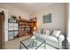 Cozy sitting room featuring a comfortable sofa and built-in shelves at 1380 Secret Path Dr, Fort Mill, SC 29708