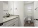 Clean bathroom with granite vanity and a bathtub at 1506 Collinston Dr, Gastonia, NC 28052