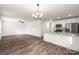 Open concept dining area with hardwood floors and kitchen island at 1506 Collinston Dr, Gastonia, NC 28052