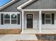 Charming front entrance with gray door and white columns at 1506 Collinston Dr, Gastonia, NC 28052