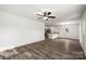 Bright and spacious living room with hardwood floors and a ceiling fan at 1506 Collinston Dr, Gastonia, NC 28052