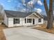 Newly built home with white siding, gray accents, and a covered porch at 1508 Collinston Dr, Gastonia, NC 28052