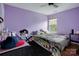 Bedroom with a double bed and purple walls at 2111 Bennett Woods Ct, Charlotte, NC 28216