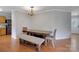 Dining area with a rustic wooden table and bench seating at 2111 Bennett Woods Ct, Charlotte, NC 28216