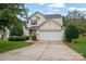 Two-story house with attached garage and landscaping at 2111 Bennett Woods Ct, Charlotte, NC 28216