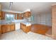 Kitchen with wood cabinets and access to dining area at 218 Kingsway Cir, Charlotte, NC 28214