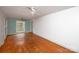 Living area with hardwood floors and large window at 218 Kingsway Cir, Charlotte, NC 28214