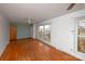 Bright living room with hardwood floors and large windows at 218 Kingsway Cir, Charlotte, NC 28214