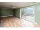 Living room with hardwood floors and sliding glass doors at 218 Kingsway Cir, Charlotte, NC 28214