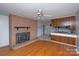 Living room with brick fireplace and hardwood floors at 218 Kingsway Cir, Charlotte, NC 28214