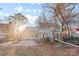 Spacious backyard with patio, fire pit, and volleyball net at 2512 Heathershire Ln, Matthews, NC 28105