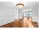 Well-lit dining area with hardwood floors and access to the living room at 2512 Heathershire Ln, Matthews, NC 28105