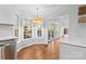 Bright kitchen nook with view to backyard and access to sunroom at 2512 Heathershire Ln, Matthews, NC 28105