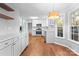 Modern kitchen with white cabinets and quartz countertops at 2512 Heathershire Ln, Matthews, NC 28105