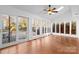 Sunroom addition with hardwood floors and access to backyard at 2512 Heathershire Ln, Matthews, NC 28105