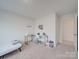 Well-lit bedroom with a desk and twin-size bed at 2643 Idared Dr, Dallas, NC 28034