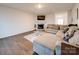 Living room with L-shaped sofa, fireplace and hardwood floors at 2643 Idared Dr, Dallas, NC 28034