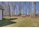 Spacious backyard with mature trees and grassy area at 2712 Yellow Bell Way, Monroe, NC 28112