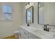 Bathroom with double vanity, quartz countertop, and mirrors at 2712 Yellow Bell Way, Monroe, NC 28112