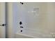 Bathroom with shower/tub combo and white tile at 2712 Yellow Bell Way, Monroe, NC 28112