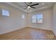 Bright bedroom with hardwood floors and multiple windows at 2712 Yellow Bell Way, Monroe, NC 28112