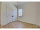 Spacious bedroom with double doors and wood flooring at 2712 Yellow Bell Way, Monroe, NC 28112