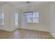 Light-filled dining area features hardwood floors and a modern chandelier at 2712 Yellow Bell Way, Monroe, NC 28112