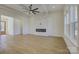 Spacious living room features a stone fireplace and ceiling fan at 2712 Yellow Bell Way, Monroe, NC 28112