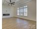 Open living area with hardwood floors, fireplace, and large windows at 2712 Yellow Bell Way, Monroe, NC 28112