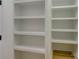 Built-in white shelves offer ample storage space in this pantry at 2712 Yellow Bell Way, Monroe, NC 28112