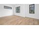 Bright bedroom with hardwood floors and multiple windows at 308 Dover Ave, Charlotte, NC 28209