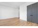 Spacious bedroom with hardwood floors and gray doors at 308 Dover Ave, Charlotte, NC 28209