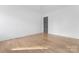 Bright bedroom with hardwood floors and a modern door at 308 Dover Ave, Charlotte, NC 28209